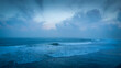 © mfahryf - Serene ocean waves under a dramatic sky breathtaking coastal view peaceful waterscape