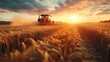 © Waraporn - Dramatic sunset over a vast golden wheat field in the idyllic countryside with a combine harvester working to harvest the abundant crop