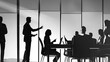 © FANTASY WORLD - Silhouette of business people in a meeting room with a presenter standing at the front of the room