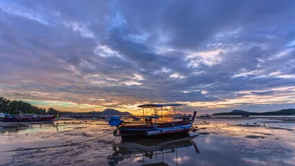 Wall Mural - Time lapse beautiful sunrise landscape Amazing light of nature cloudscape sky.
first light above archipelago in Rawai gulf sweet sky above fishing boat.
4k stock footage video in travel concept.