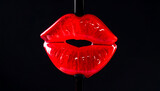 Bold, luscious red lips against black. Suggests beauty, sensuality, and temptation. Great for cosmetics, Valentines Day, or romance related creative projects.