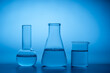 © ADDICTIVE STOCK - Glassware in laboratory with blue lighting and water