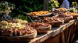 © Ruma - Outdoor buffet spread of various dishes on wooden platters.