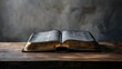 © paukan - Vintage open book with golden pages resting on a rustic wooden surface