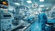 © ngalong project - Operating room with medical equipment and personnel blurred in the background.