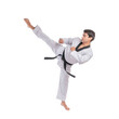 © suphaporn - Martial artist performing high kick in traditional karate uniform isolated on a transparent background, young man in action pose wearing black belt practicing taekwondo or martial arts