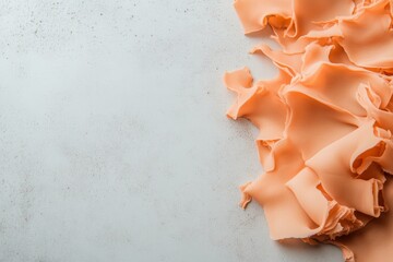 Fototapete - A vibrant orange coral reef fragment with intricate textures stands out against a clean white background, showcasing its underwater beauty