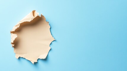 Aufkleber - Overhead view of a torn piece of notebook paper on a bright blue pastel background, highlighting the frayed edges and providing ample copy space for text