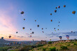 © Cavan Images - Hot air balloons flying over Cappadocia at sunrise