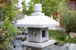 © Galina - Traditional Japanese style stone lantern in garden - toro