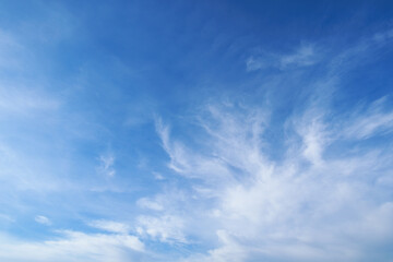 Wall Mural - beautiful blue sky with soft white clouds for abstract background