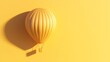 © muhammad - Golden hot air balloon on a vibrant yellow background