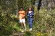 © bulentcamci - Happy and athletic young couple running in the forest.