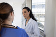 © ReeldealHD images - Doctor and Nurse Discussing Patient Care in Hospital