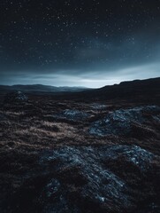 Wall Mural - a dark sky with a few stars and a mountain in the background. the sky is filled with a sense of calm