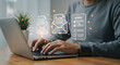 © abu - Man Typing On Laptop With Email Icon Overlay On Desk In A Bright Room