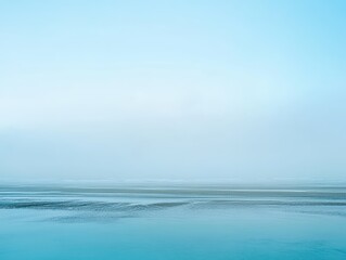 Poster - Serene coastal vista featuring a tranquil beach landscape with soft light and calming blue hues creating a peaceful and minimalist atmosphere for relaxation