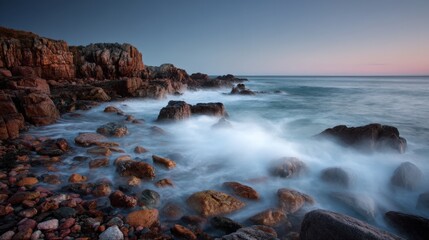 Wall Mural - serene coastal landscape with smooth water and rocky shoreline