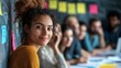 © Khoirur - Smiling woman in a collaborative business setting