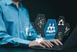 © Supatman - Onboarding new employee process concept. A businessman using laptop with icons representing onboarding process, training, recruitment, communication, hiring, development, and employee integration.