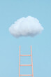 © photo for everything - Ladder to the Sky: Dreamy image of a pink ladder reaching towards a fluffy white cloud against a soft blue sky, symbolizing hope and possibility.