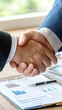 © Sergey - Business handshake between executives symbolizing partnership and agreement in professional setting