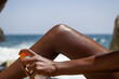 © Milles Team/Stocksy - Woman applying sunscreen on leg