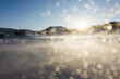 © Heng Yu/Stocksy - Snow on Lens with Blowing Snow at Sunrise