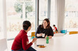 © Melissa Milis Photography/Stocksy - Mother and educator positive interaction at day care center interview