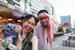 © Jovo Jovanovic/Stocksy - Happy young woman taking selfie with a friend