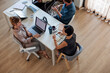 © Jovo Jovanovic/Stocksy - Colleagues talking at work