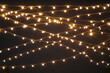 © Maryanne Gobble/Stocksy - Outdoor Party Lights in Night Sky