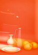 © Irina Ozhigova/Stocksy - Still life composition featuring a glass jug, fruit, and a branch with