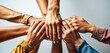 © chanwut - Diverse hands clasped together, symbolizing unity and collaboration, joint, helping