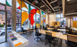 © VICTOR TORRES/Stocksy - Modern coworking space with vibrant window art