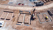 © Dave Wall/Stocksy - Foundations for houses on a housing estate