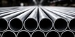 © michnik101 - Close-up of stacked metal tubes in industrial warehouse. steel pipe manufacturing and storage