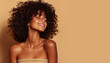 © edwardderule - Beauty portrait of african  girl with clean healthy skin on beige background. Smiling dreamy beautiful black woman.Curly  hair in afro style