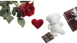 A romantic arrangement featuring a rose, heart, teddy bear, chocolate, and wrapped gift box