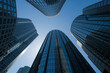 © GS-Studio - Low angle view of modern skyscrapers against a clear blue sky.