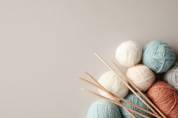 Wall Mural - minimalistic flat lay composition featuring collection of knitting yarns and crochet hooks neatly ar