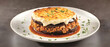 © Parsudi - Layered Eggplant Moussaka Dish On White Plate