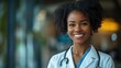 © Daisha - Radiant african american physician in white coat portrait with stethoscope