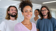 © Ilya - Creative team smiling confidently around a whiteboard