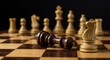© Ai Images Stock - Fallen king piece on chessboard game