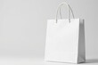© Sunisa - Close-up of a pristine white shopping bag, isolated , handle, fold