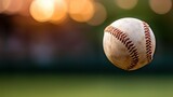 A detailed photograph showing a baseball in mid air with stitches