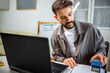 © Mediteraneo - Man stamping an important document in the office.