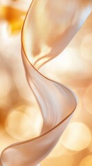 Wall Mural - elegant beige ribbon gently waving on golden bokeh background