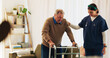 © peopleimages.com - Caregiver, elderly man and help with walker for mobility, balance support and rehabilitation. Healthcare, nurse and senior person with disability for assistance, medical recovery and guidance at home
